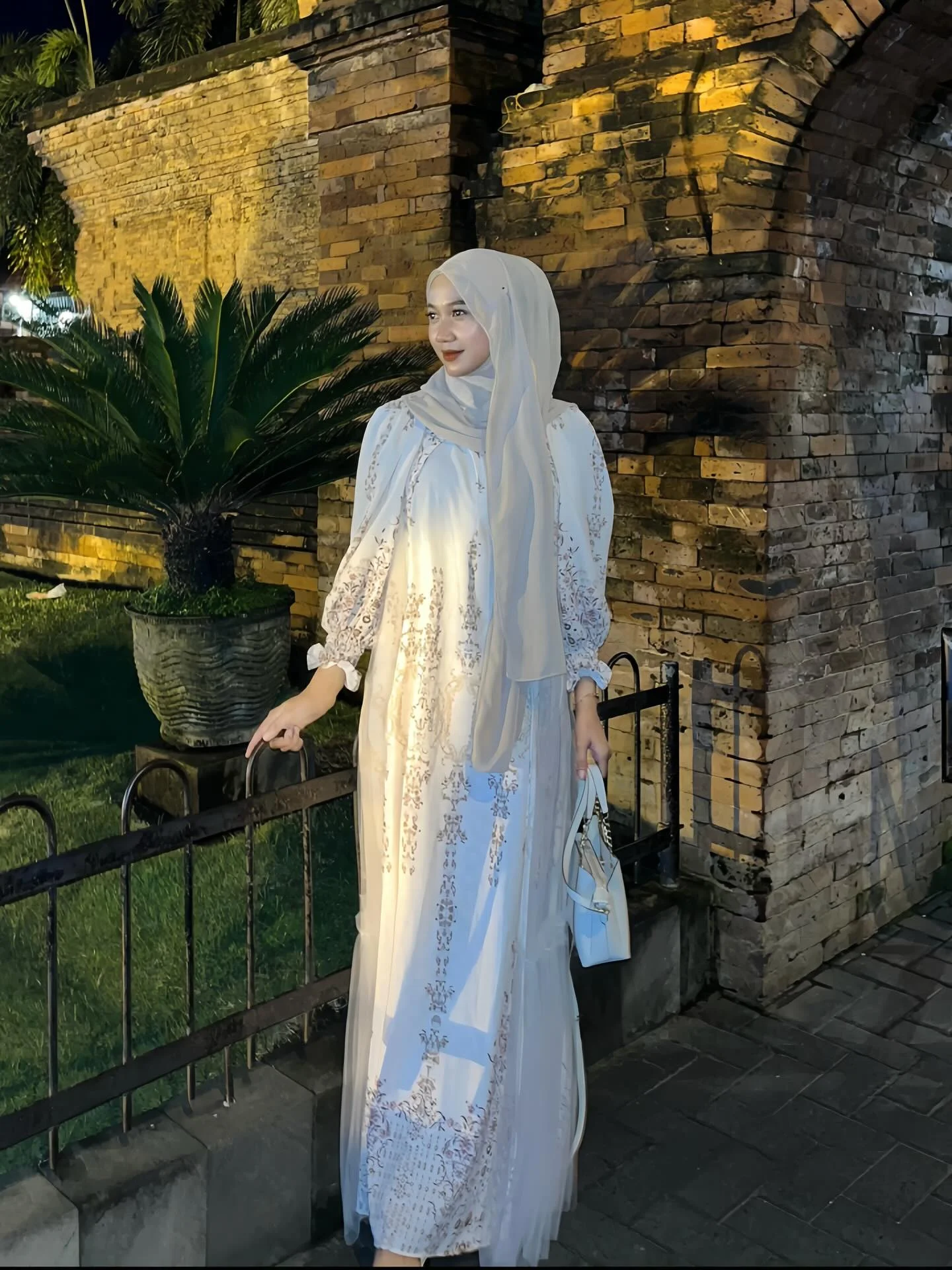 Photo by latansaa on February 18, 2026. May be an image of headscarf, gown and text.