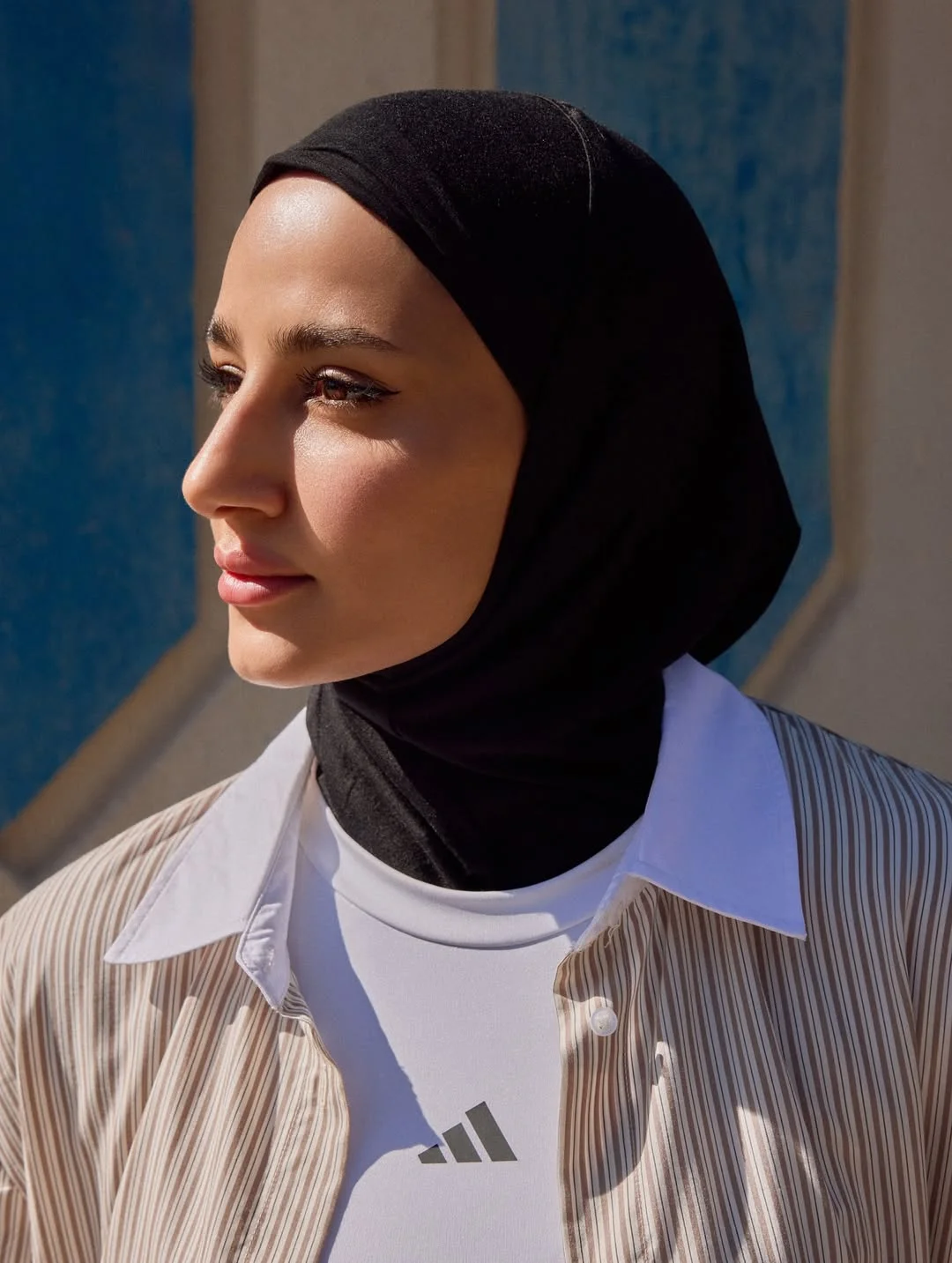 Photo by adidas Arabia on February 19, 2026. May be an image of headscarf, sportswear, turtleneck and text.