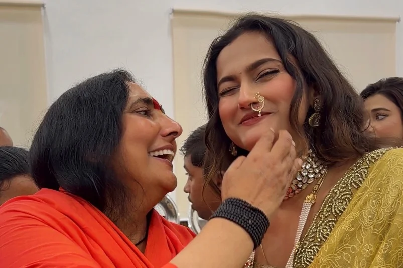 Photo shared by Aishwarya Kaushik on February 19, 2026 tagging @sadhviritambhara. May be an image of one or more people, makeup, people smiling and text.