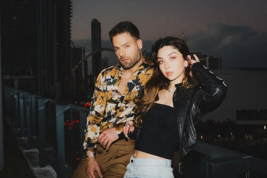 Photo by ViX Micro on February 18, 2026. May be an image of one or more people, makeup, flight jacket, turtleneck and text.