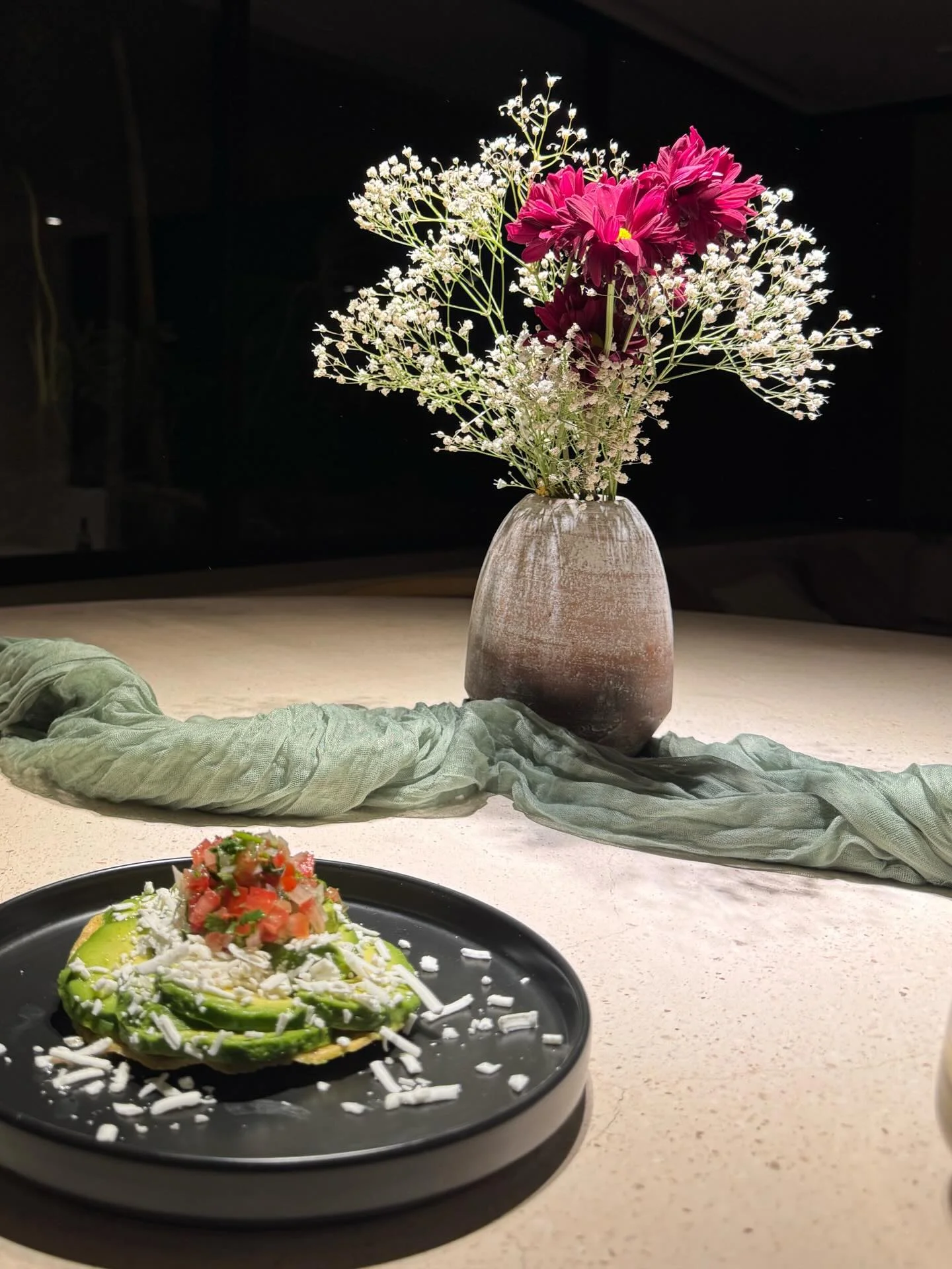 Photo by Alexandra on February 17, 2026. May be an image of sushi, sashimi, avocado, fritter, flower arrangement and text.