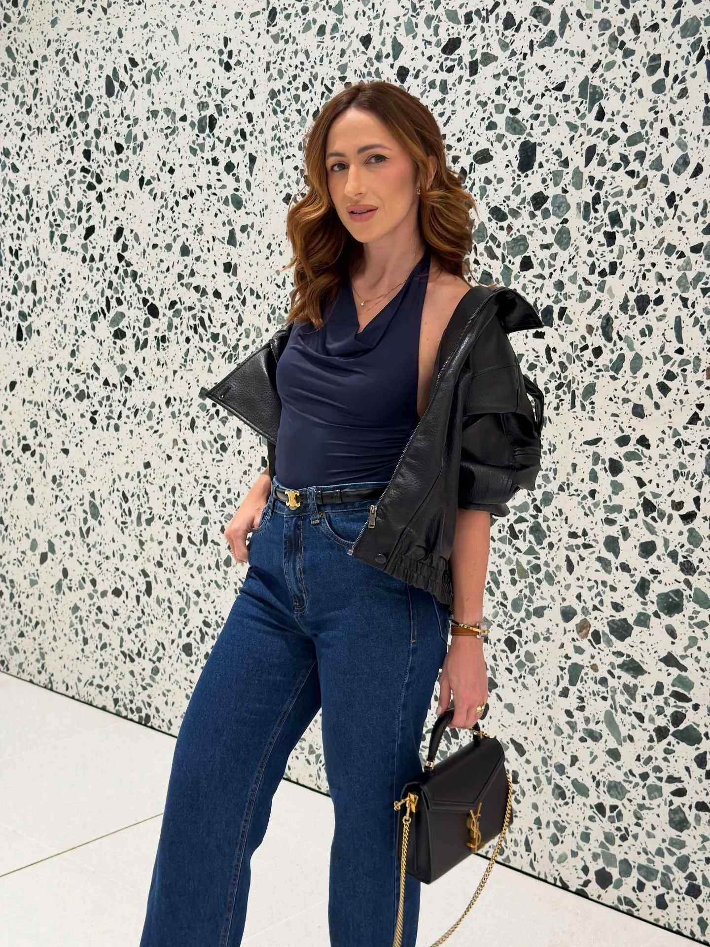 Photo shared by Alini Bosko on February 17, 2026 tagging @ysl. May be an image of jacket, slingback shoes and text.