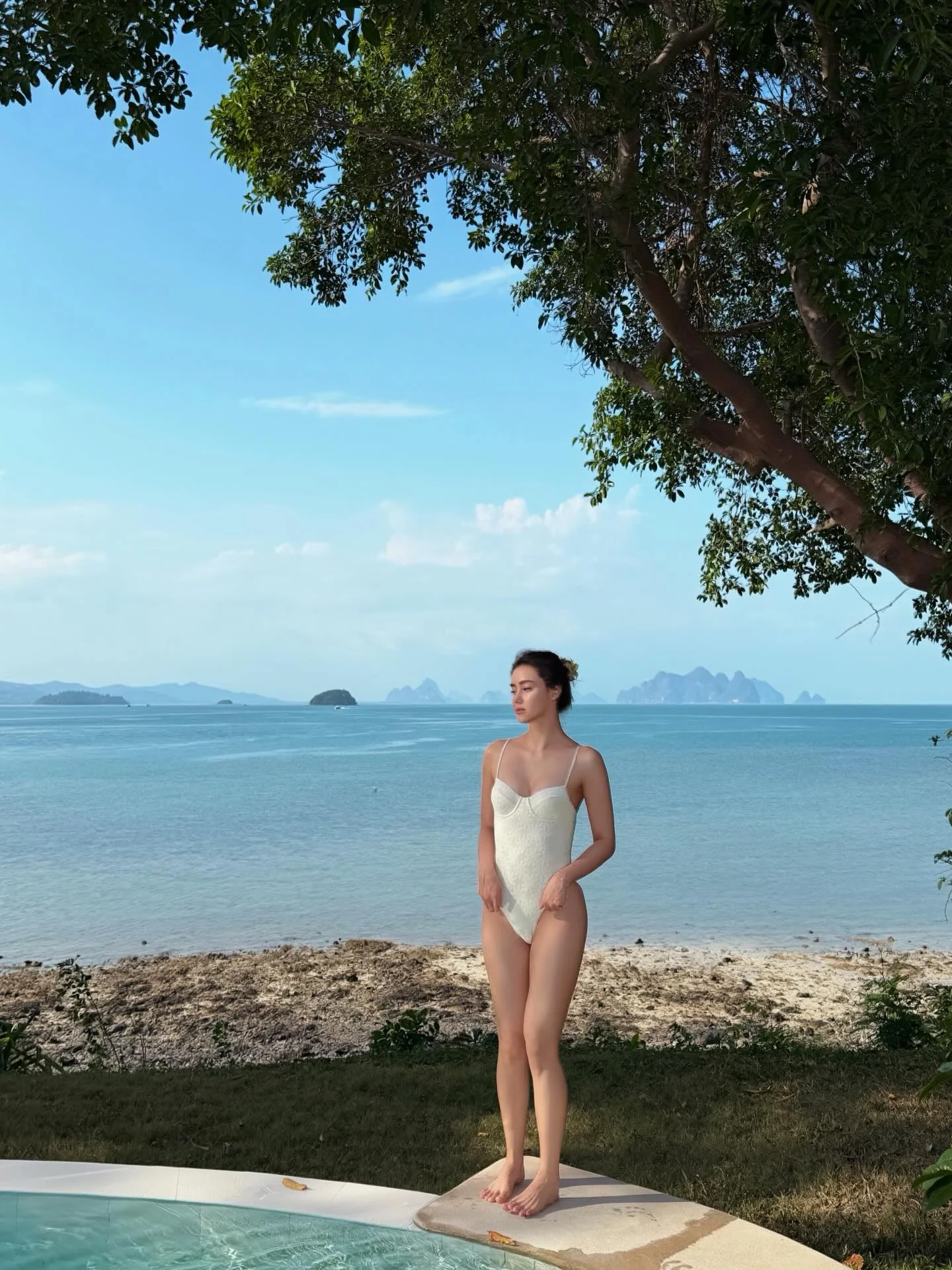 Photo shared by Amanda Obdam on March 17, 2026 tagging @nakaislandphuket, and @gigibeachbabes. May be an image of wetsuit, pool, ocean, horizon and text.