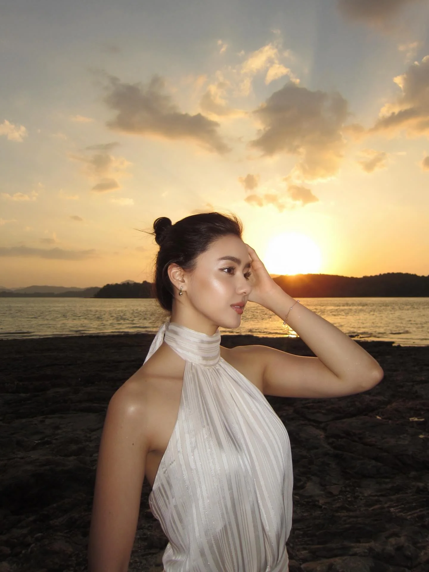 Photo shared by Amanda Obdam on March 18, 2026 tagging @nakaislandphuket. May be an image of one or more people, makeup, gown, sarong, dress, outdoors and text.