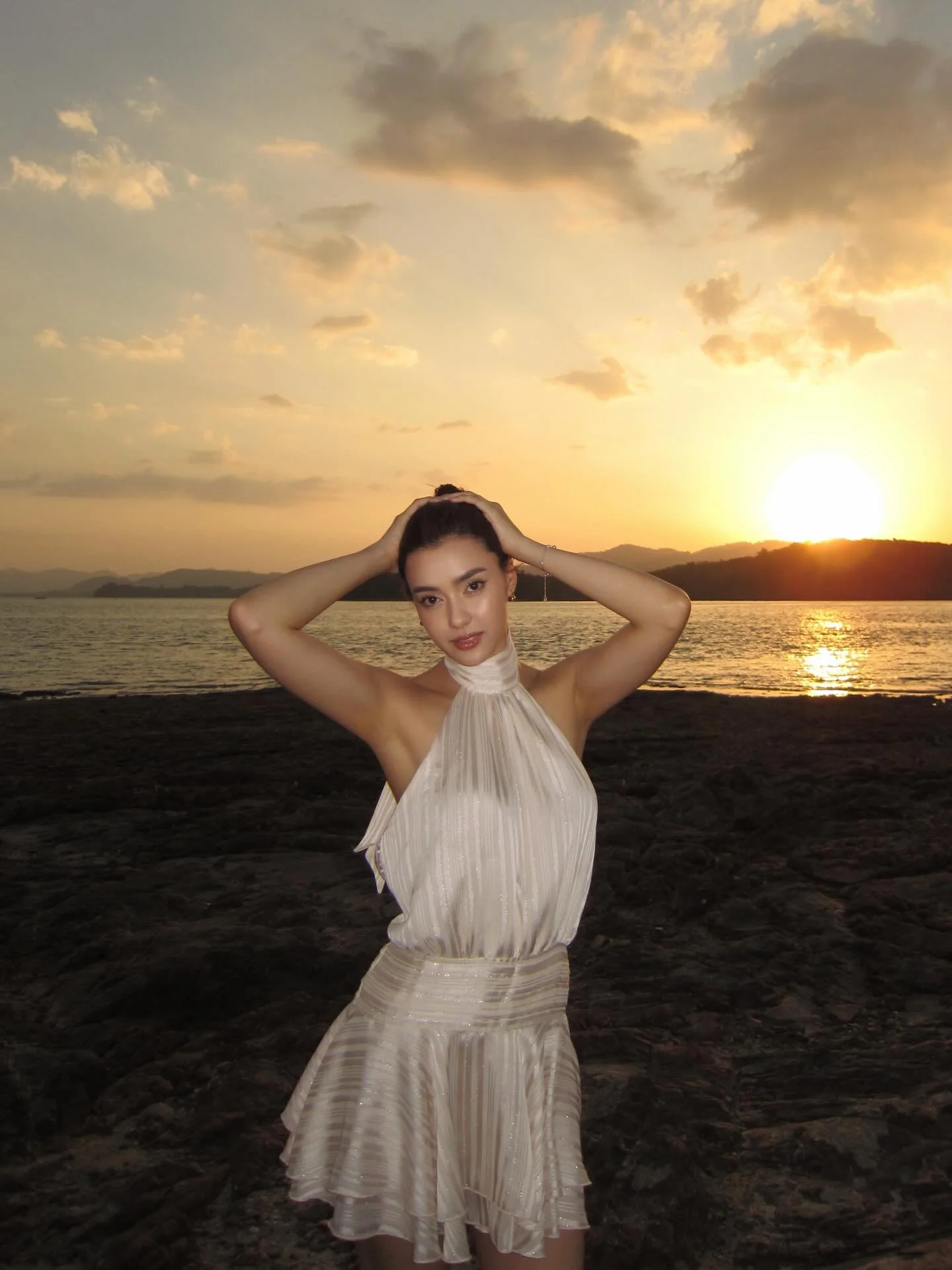 Photo by Amanda Obdam on March 18, 2026. May be an image of sarong, dress, sundress, beach and text.