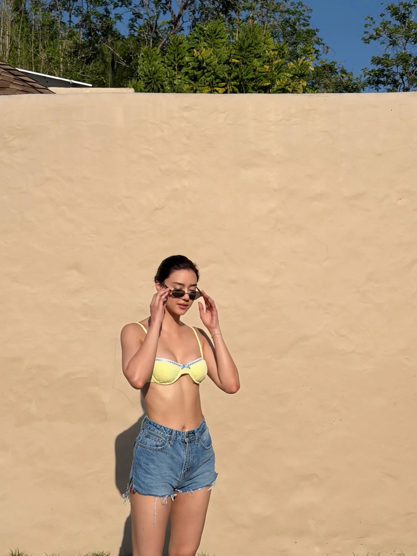 Photo by Amanda Obdam on March 21, 2026. May be an image of one or more people, activewear, eyewear, headscarf, shorts and text.