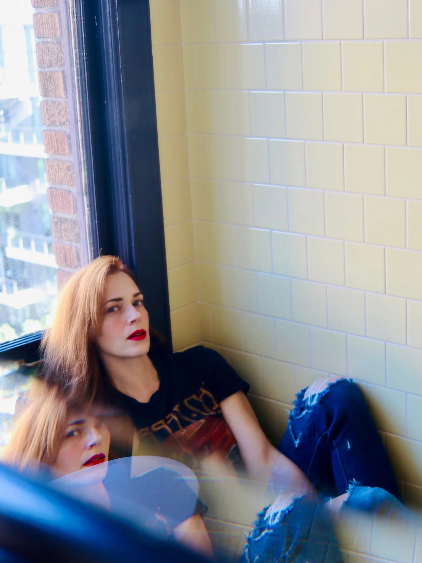 Photo by the bare magazine on March 11, 2026. May be an image of mirror, window, brick wall and text.