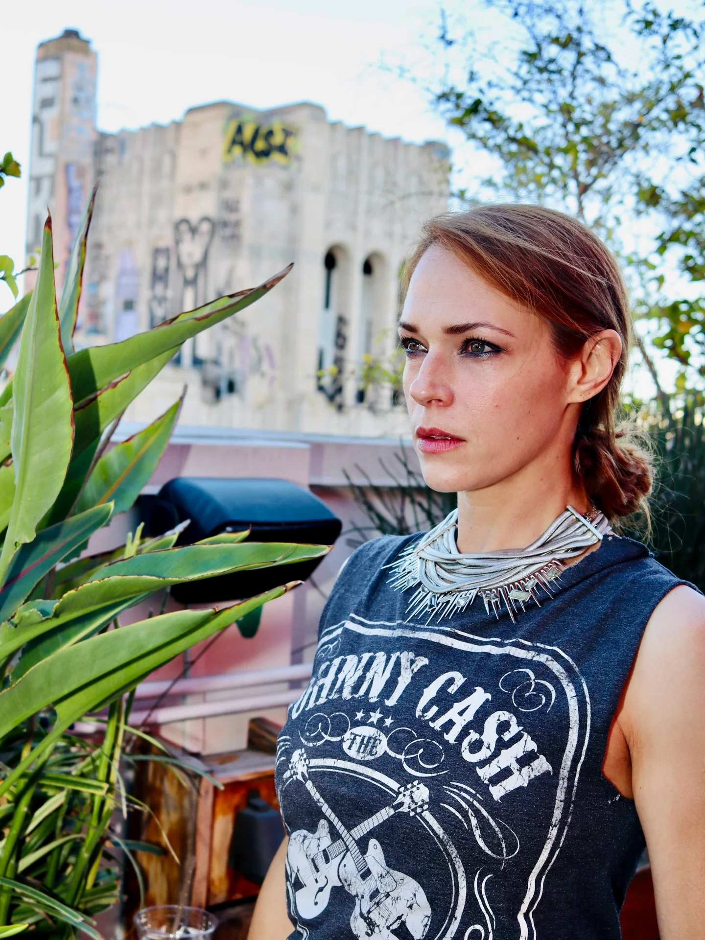 Photo by the bare magazine on March 11, 2026. May be an image of one or more people, blonde hair, tanktop, headscarf and text.