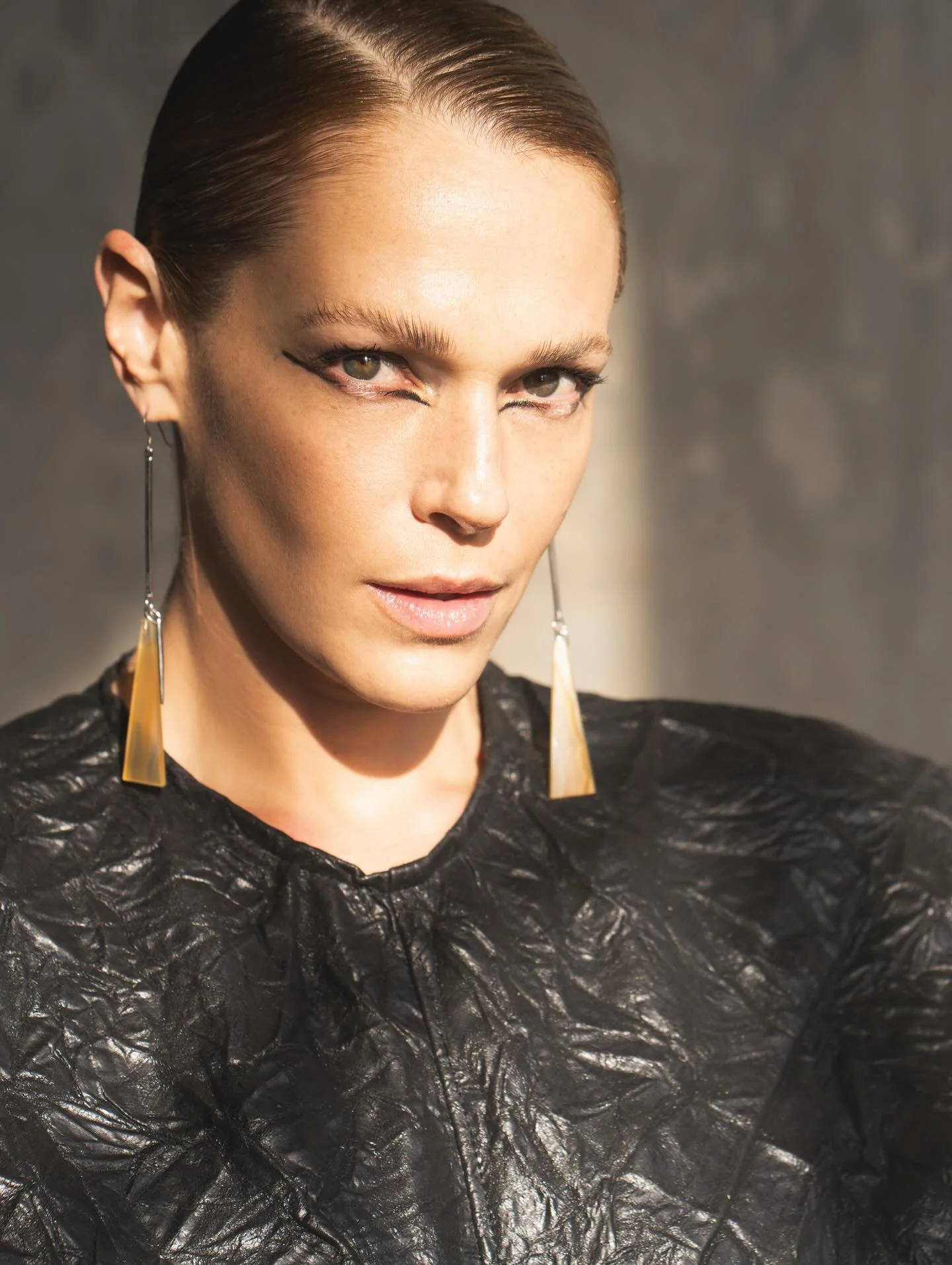 Photo by 71 Magazine on March 18, 2026. May be an image of one or more people, makeup, leather, jewelry and text.