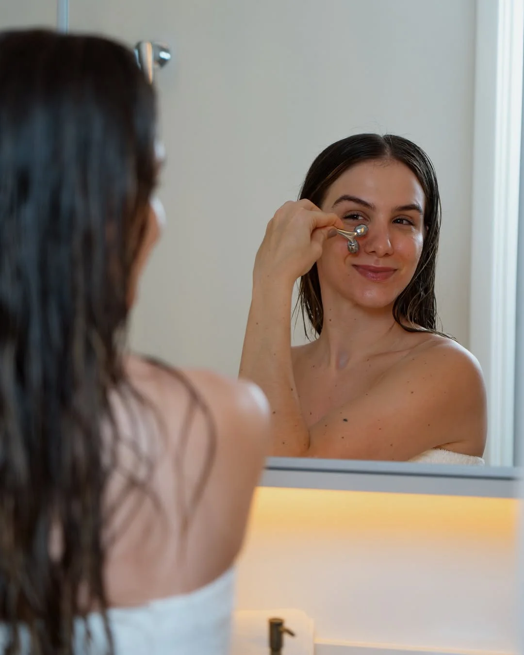 Photo by Amanda Ferrari on February 18, 2026. May be an image of one or more people, makeup, mirror, shower and text.