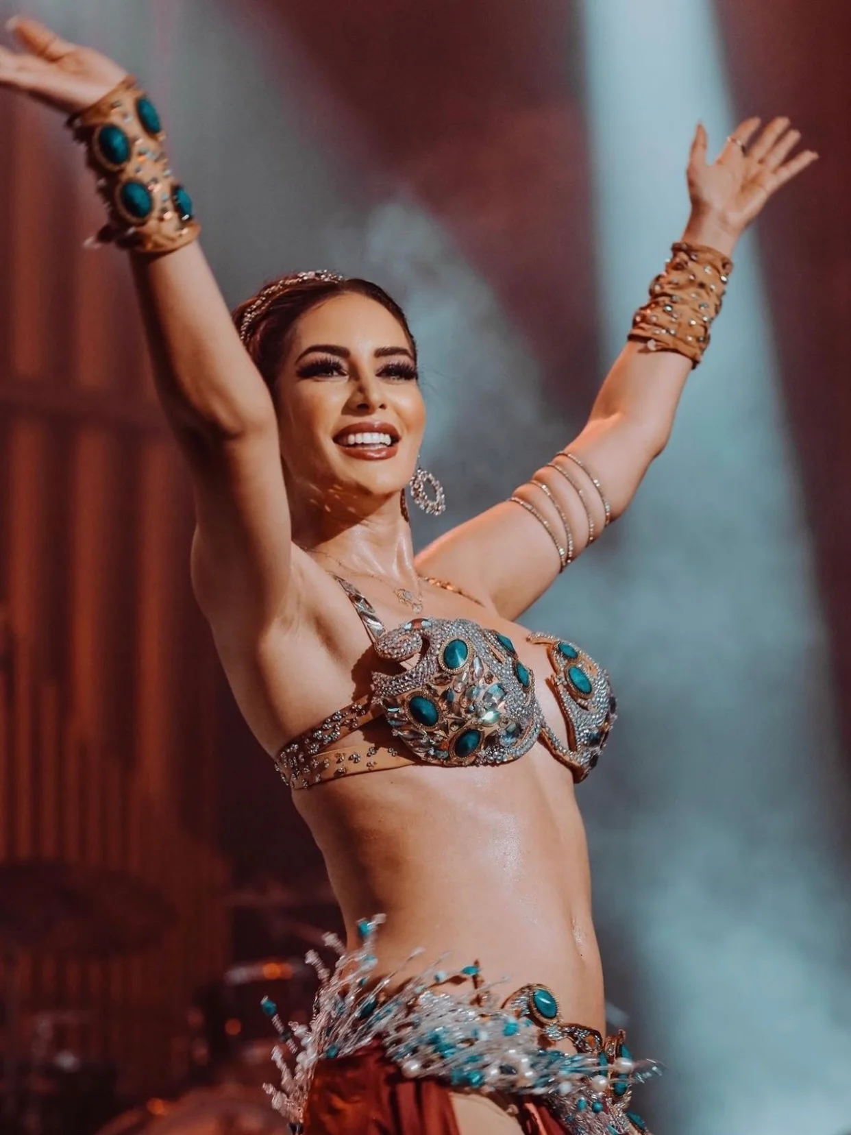 Photo by Amie Sultan ايمي سلطان on March 28, 2026. May be an image of dancing, costume, tambourine and text.