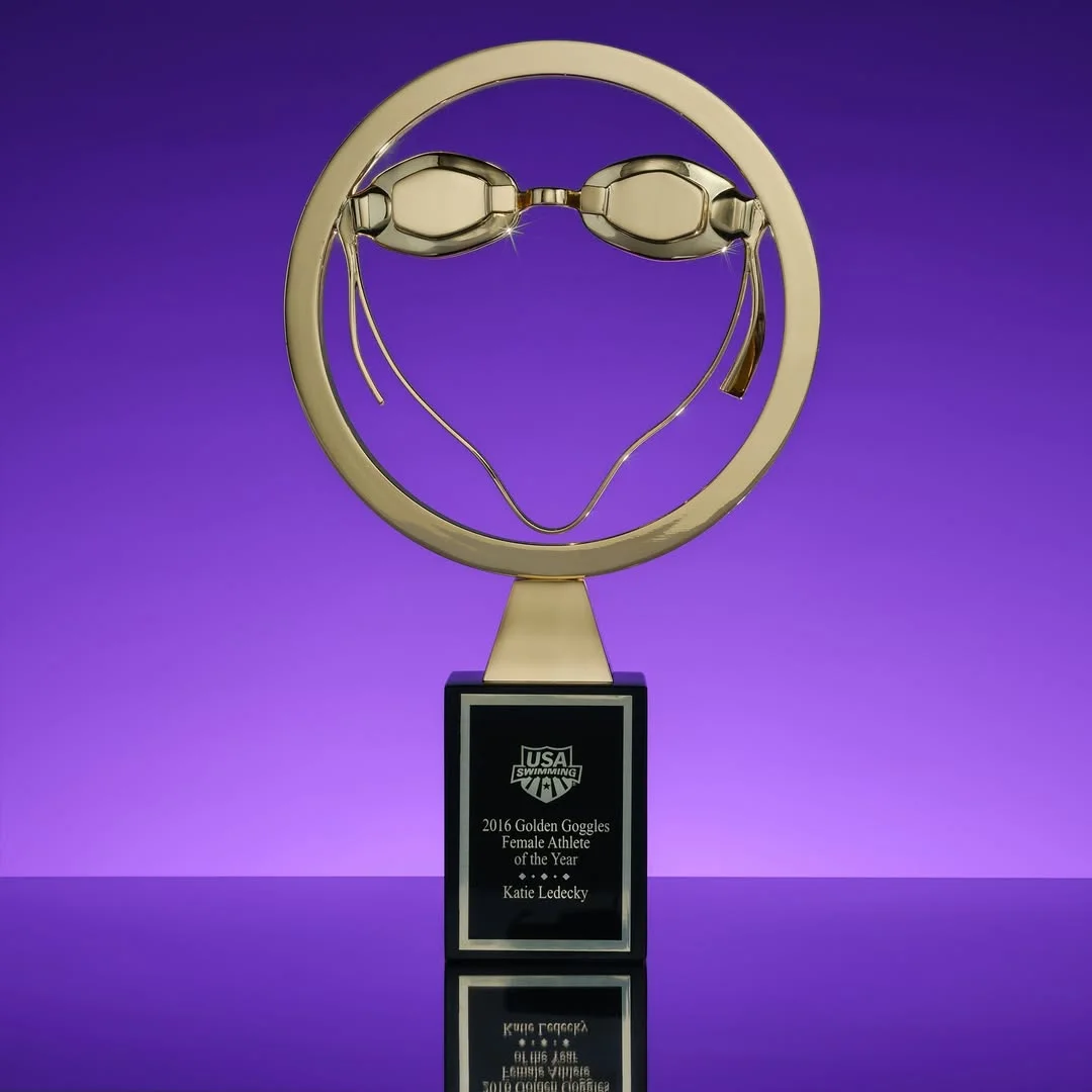 Golden Goggles Award on a purple background.