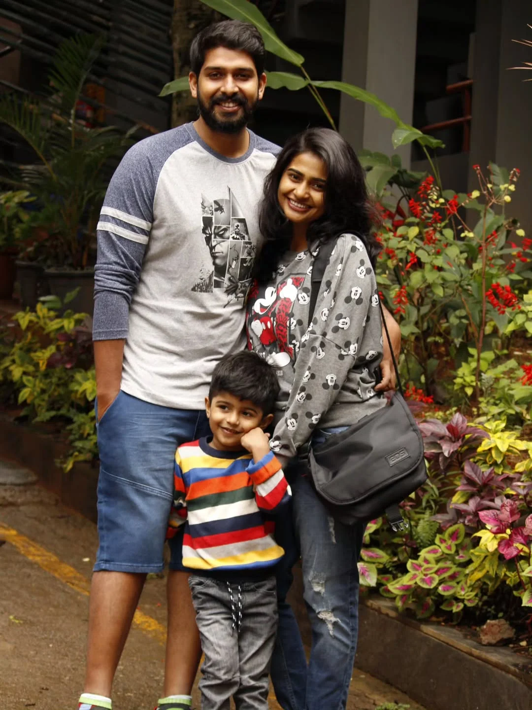 Photo shared by Abishek Chandamarakshan on February 20, 2026 tagging @amruthaabishek, and @aadivabishek. May be a selfie of one or more people, beard, child, people smiling, people standing and text.